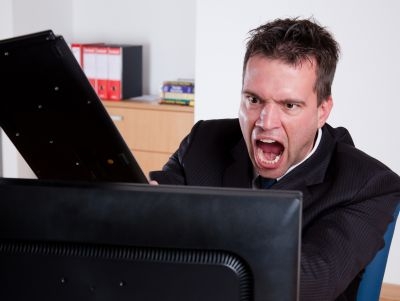 All this man wanted was proper mouse-and-keyboard controls in Dungeon Siege III. Now, just look what he's been reduced to: A stock photograph of a man angry at a computer.