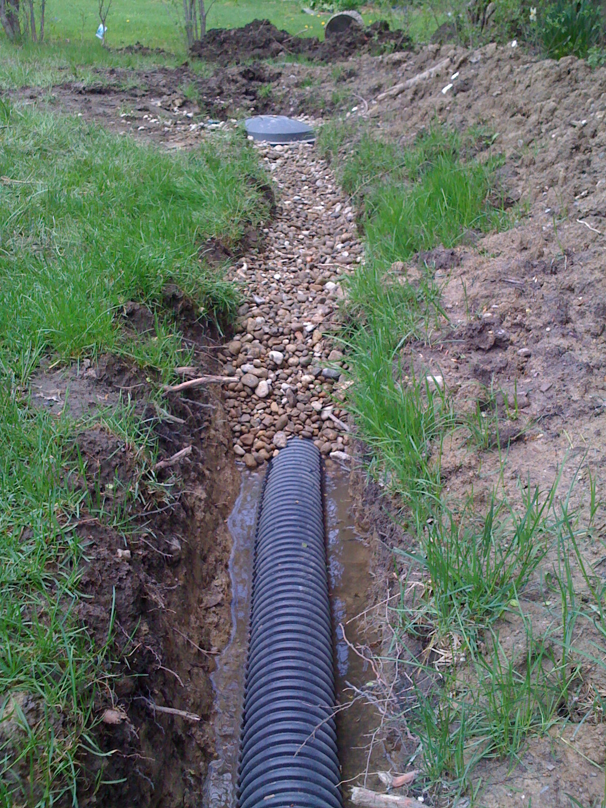  5. Cover pipe with 1/2 inch washed  gravel. 