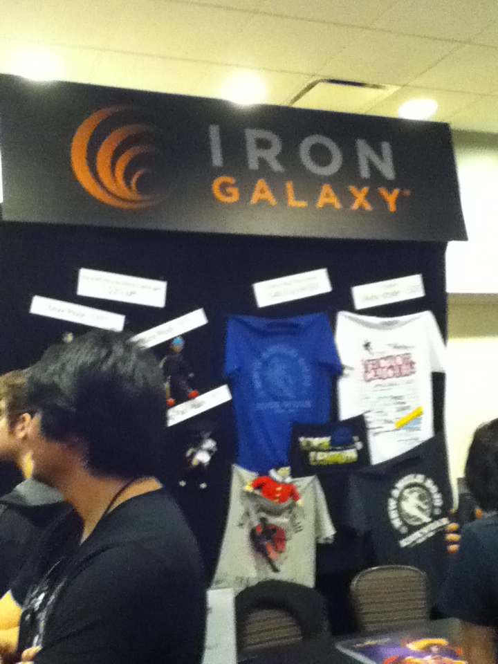 Iron Galaxy booth featuring Reynald of KOF XIII fame (bottom left)