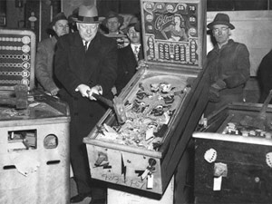 Pinballs being smashed by NYC officials duing the 1942 pinball ban.
