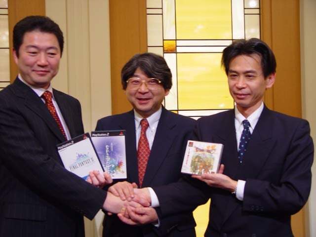 Yoichi Wada, Yasuhiro Fukushima, & Keiji Honda announce the merger. Also, Unlimited Saga being one of three games held in this photo op is WILD!