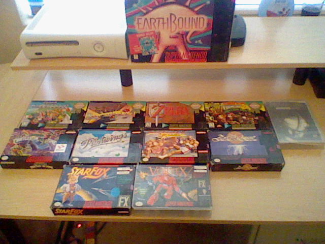 My collection of boxed SNES games, including EarthBound at the top (minus Mario Paint). 
