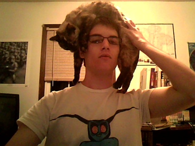 Me, wearing my thinking cat. She was strangely okay with it.