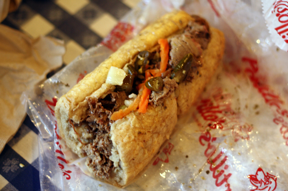 Portillo's Italian Beef with hot peppers, dipped in au jus