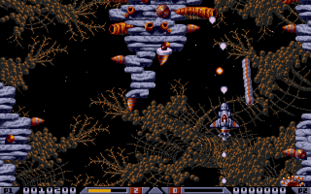 These centipedes are the worst: each segment is a separate enemy, and they can quickly destroy the ship by flying through it. Also, at some point, I picked up a butt-cannon that fires backwards. Upgrades in Xenon 2 never disappear after losing a life, thankfully, though you can sell them.