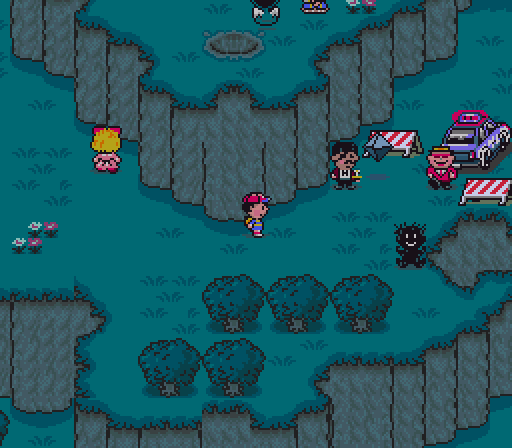 The Onett police sure are a shady-looking bunch. Meanwhile, Pokey's turned into that diamond Evangelion Angel and Paula is just staring intently at that wall. I'd really like to get past them all so I can get to where my own ghost is sitting, but that's going to have to wait until later.