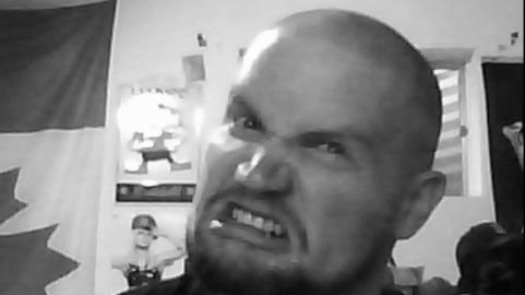 Back when I accidently shaved my hair way too short. Made the meanest face I could. 6'5`, 230lbs. Never been in a fight though...