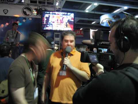 Harmonix dudes give interviews while constantly headbanging.