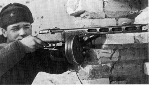  Soviet soldier wielding a PPSh-41 with the iconic drum magazine