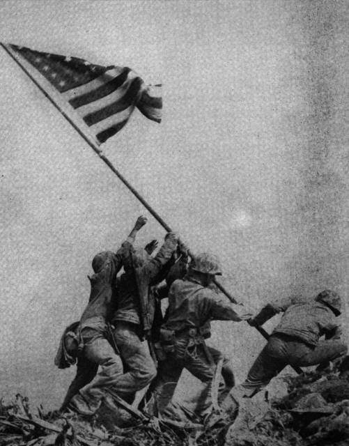 Hoisting the flag at Iwo Jima