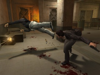 Max Payne reloading after killing an enemy.