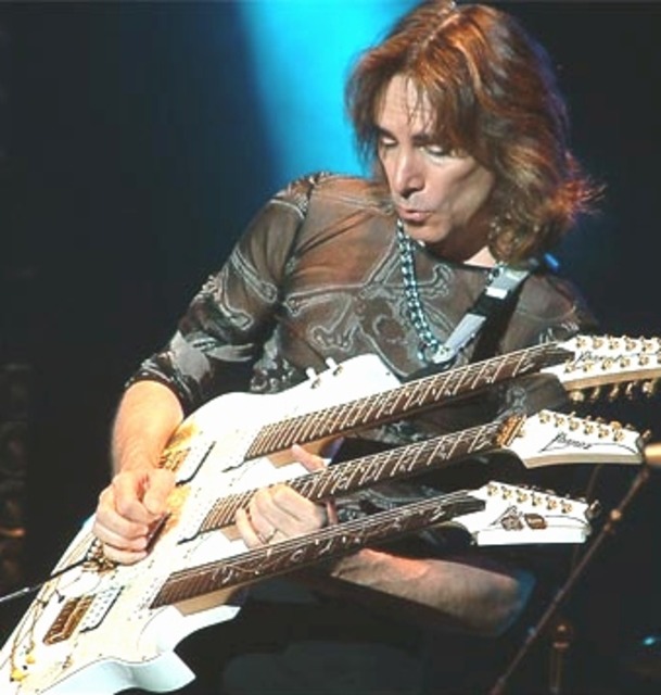 Vai with his custom triple neck guitar