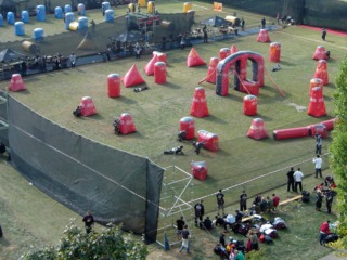Speedball uses a smaller, arena-style field with inflatable barriers.