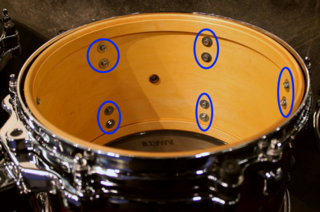 Find each of these screws inside your drum shells, which hold you drum head mounting hardware in place.