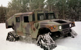 An HMMWV equiped with snow treads.