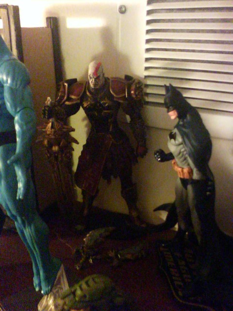 Kratos circa the beginning of GOW 2, chilling with batman, maybe checking out Dr. Manhattan's tush?
