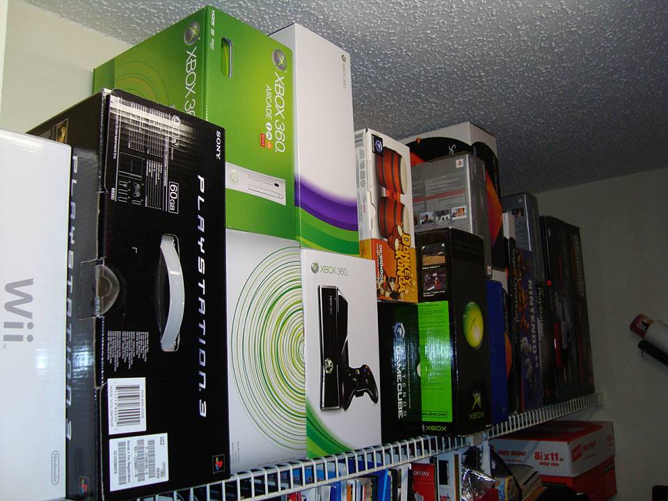 This closet's top shelf is all systems.  Why there's 3 Xbox 360 boxes is a long story.  The shelf below this is primarily E3 SWAG from 1997-2006.  Then there's a bunch of large box/collector's edition stuff.  There's also a stack of copy paper boxes full of accessories and demos that don't fit out on shelves.