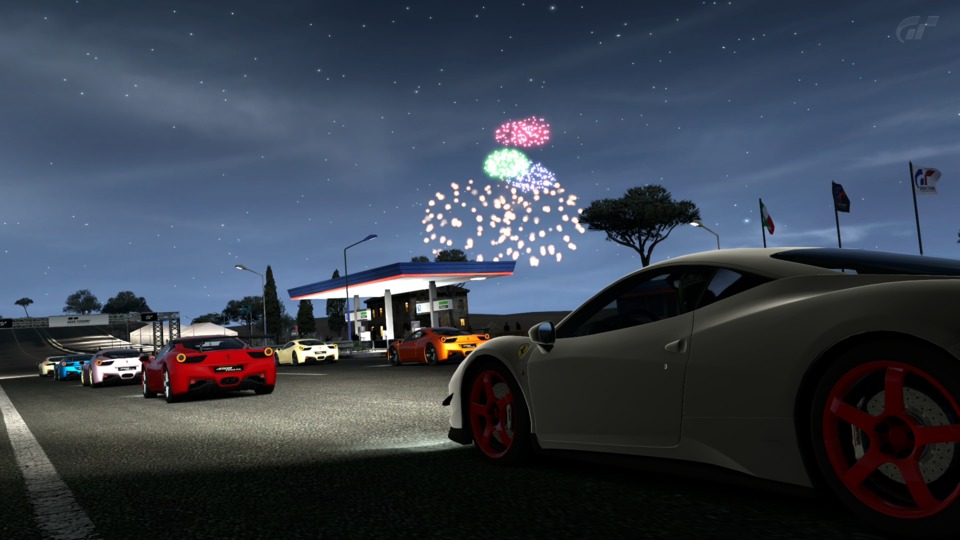  Its night time at Toscana, there's Ferraris aplenty, a gas station and lots of road. 