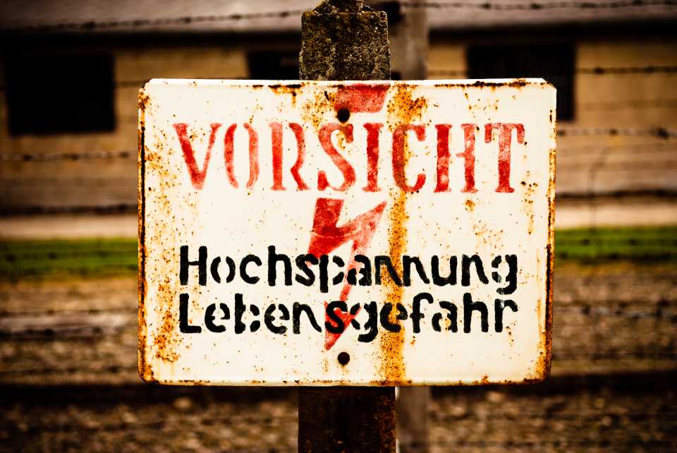 These electrified fence warning signs were all over Auschwitz. Originals from the 1940's.