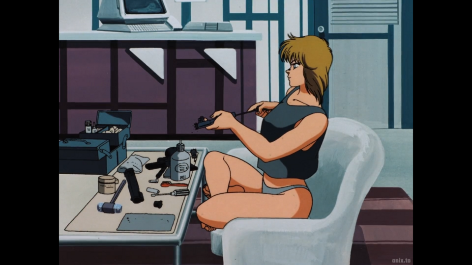 There's probably a rule written somewhere that every '80s anime action movie had to include a half-naked woman cleaning a gun. 