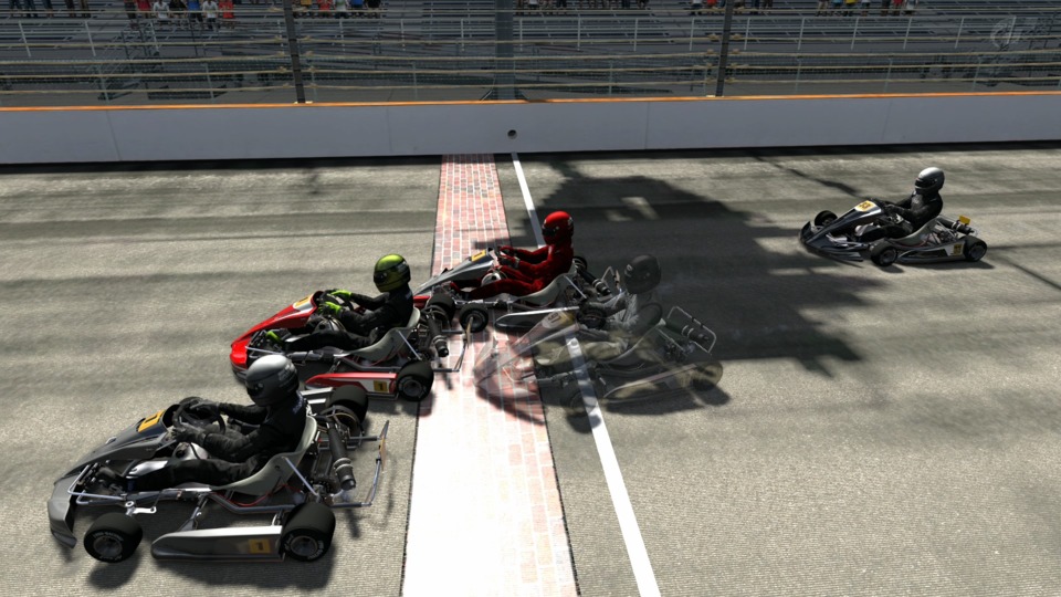  Pessh in all grey is first, Static in the red kart is second and Devil240Z in the red suit is third. The actual finish line is slightly ahead of the brick start/finish. If you squint carefully you can see the man on the grassy knoll responsible for Black_Scotch-'s crash.
