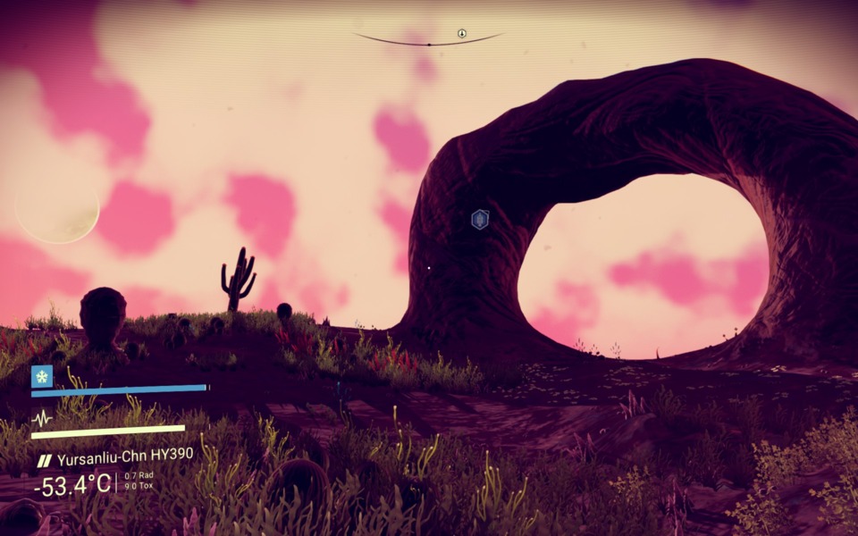 Cool rock formation  w/ planet in the sky.