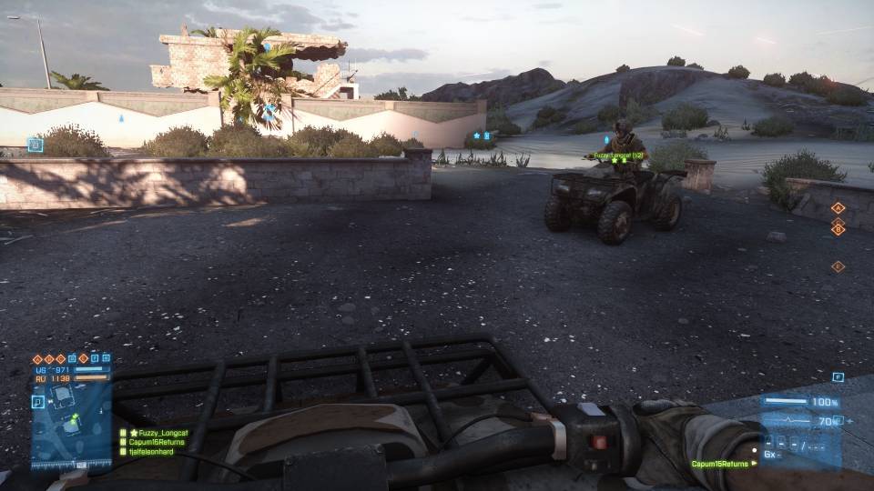 Two duders on ATVs.