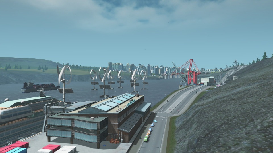 Cruise Ship Docks with Cargo Docks behind. The freighter goes through the wind turbines...should probably move those.