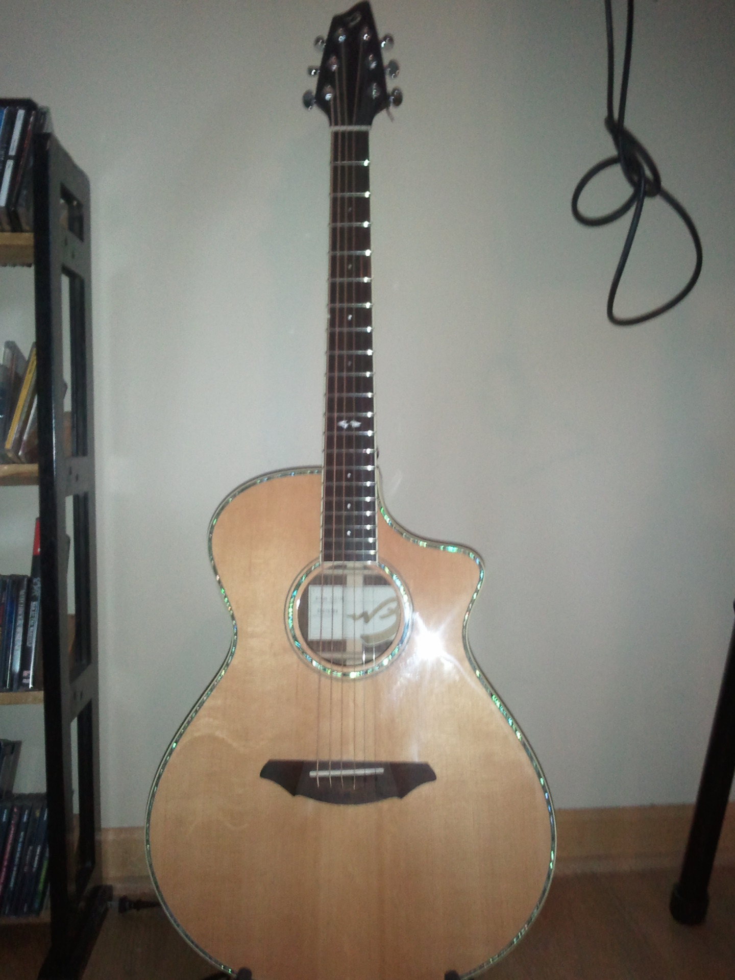  My Breedlove acoustic.  For years I played a free Carlo Robelli, before I decided to upgrade to one that could be plugged into an amp. So glad I got this one, it's an amazing guitar.
