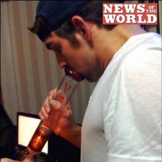 Michael Phelps using a bong to smoke marijuana. 